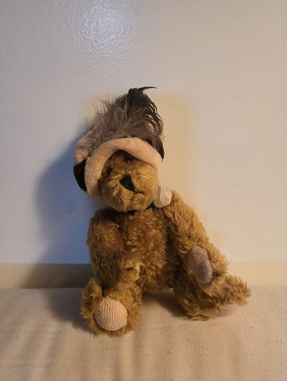 Vintage collectible teddy bear is a Boyds Bear named "Chanel De La Plumette"